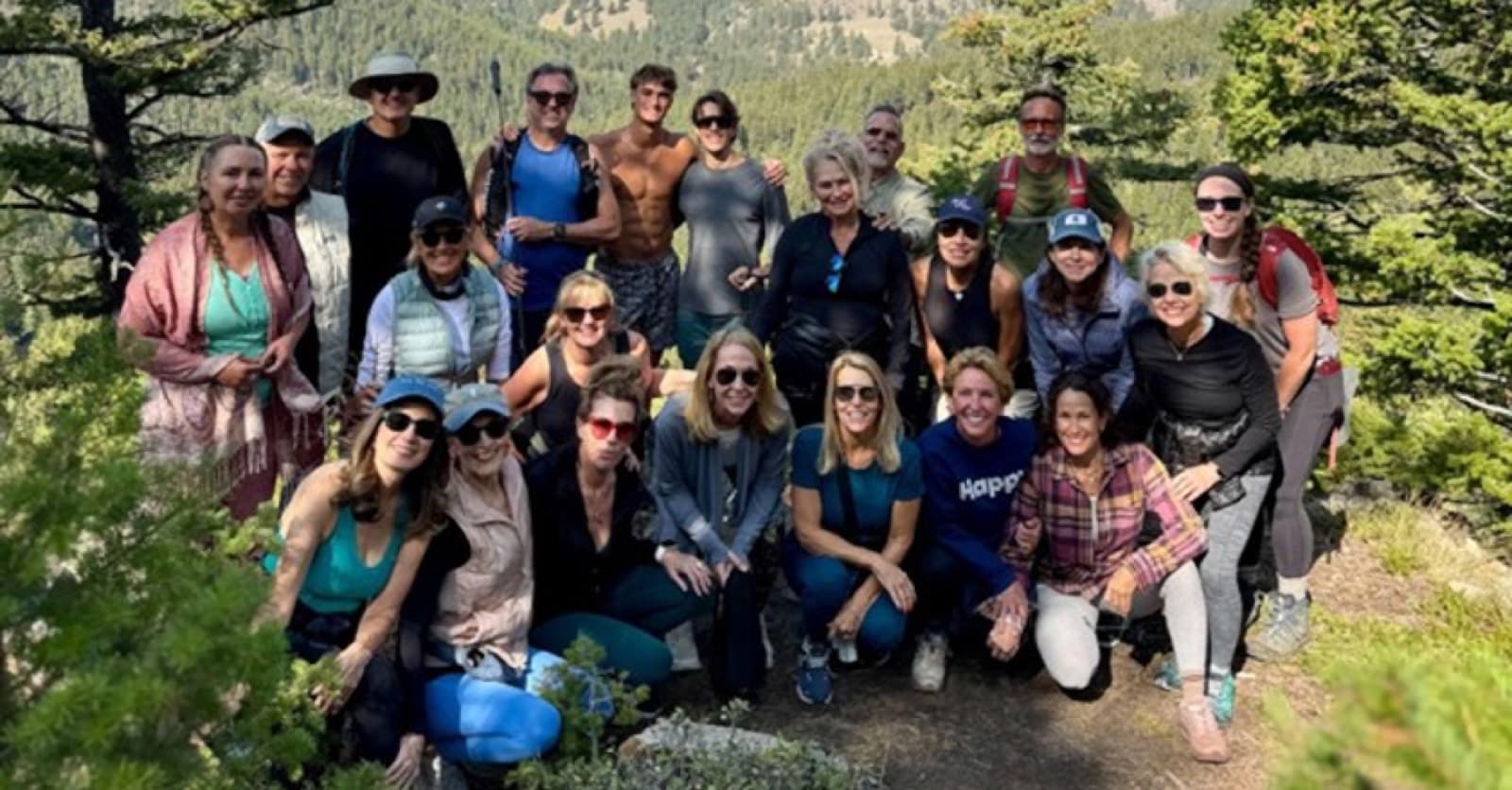 Tania Savolle and retreat participants gathered together on a mountain hike at Feathered Pipe Ranch